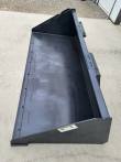 Skid steer bucket at an angle: interior floor with bolt slots, side walls and quick-attach brackets