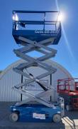 Blue Genie GS-2632 scissor lift with platform raised, scissor stack fully extended