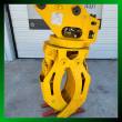 Yellow ALS1638 rotating grapple, jaws open, LYALS serial plate and rotator bearing, framed by a green border