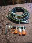 Auxiliary hydraulic kit: coiled 3/8 in hoses, coupler bracket with flat-face quick connects, lever, adapters