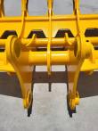 Twin mounting arms and pin bores on the yellow rake, cross tubes and cut-out back plate behind