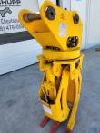 Yellow ALS1638 rotating grapple standing jaws-open, LYALS serial plate on the head, red tooth tips