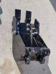 Black 8-inch trenching bucket, digging teeth and side cutter plates, bolt-on pin hitch at the back