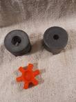 Three-piece jaw coupler: two steel hubs, one keyed bore and one splined, with orange spider insert
