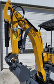 SDLE20 mini excavator boom and arm folded in, serrated hydraulic thumb against the arm above the toothed bucket