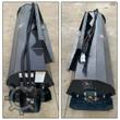 Wolverine tiller hood: hydraulic hoses along the top, drive motor housing, bearing flange and safety decals