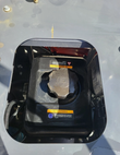 MX15R mini excavator fuel tank cap under the open deck hatch, with engine warning labels