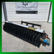 AGT hydraulic angle broom at an angle: full black bristle roller, quick-attach mount and blue drive motor