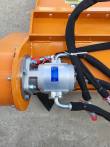 Hydraulic motor bolted to the flail mower's end housing with red-capped couplers and sleeved hoses