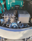 QK16R mini excavator engine bay: air-cooled engine with guarded muffler, air cleaner and fuel tank