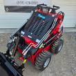 Future FT323TZ wheeled mini skid steer's dual joystick controls and boom arm