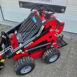 Future FT323TZ wheeled mini skid steer's boom arm, bucket linkage, and tires