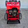Future FT323TZ wheeled mini skid steer, rear view with engine bay open, 420cc engine visible