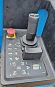 Scissor lift platform control box: joystick with grip, red emergency-stop button, function-icon buttons and auto-level switch