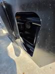 Access port on the planer drum's side panel, showing the internal bearing and frame