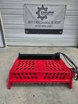 GIYI Mini Rock Rake skid steer attachment, red frame with black tine trough and mounting legs