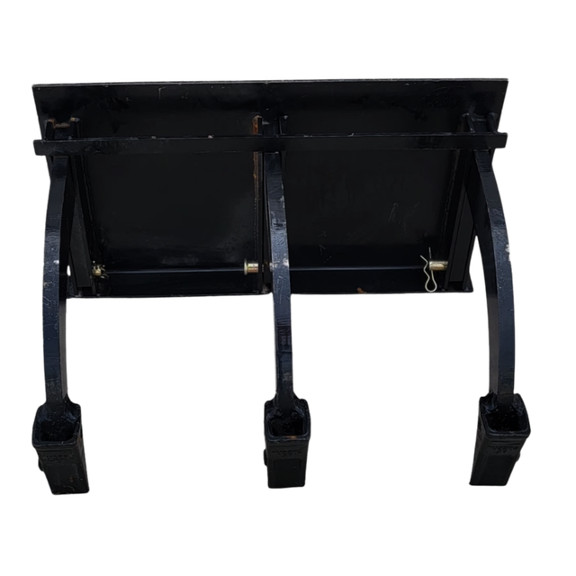 Black three-shank mini skid steer ripper, quick-attach mount plate, cross bar with hairpin pins, square boot tips