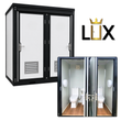 White two-door LUX portable restroom, black frame and louvered vents, with inset of both stalls open showing toilets