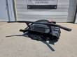 Mini disc mulcher, side view of quick-attach arms and red-capped hydraulic couplers, disc below