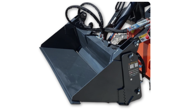 Dark gray 4-in-1 bucket open in clamshell on an orange mini skid steer, arched hydraulic hoses and Wolverine spec decal