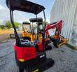 Red Miva VA13 mini excavator with canopy and boom, parked beside yellow Miva mini excavators