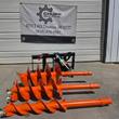 Raytree auger drive and three bits staged outside Chupp Industrial's shop