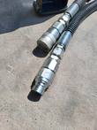 Hydraulic quick-disconnect couplers for the Raytree 680 post driver, close-up