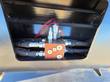 Hydraulic solenoid valve and hose fittings inside the Raytree power rake bucket's mount frame