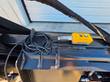 Yellow LEFT/RIGHT control switch and cord mounted on the Raytree power rake bucket's top rail