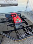 Skid steer brush cutter, front angle: 60 HP gearbox label on the red motor cover, tubular push bar and side skids