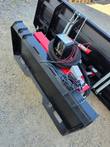 Rear of the 6-way dozer blade: skid steer quick-attach plate, red hydraulic cylinders, coiled hoses and trip springs