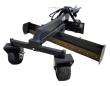 Raytree 96-inch grader blade angled to one side, bolt-on double-bevel cutting edge and two pneumatic caster wheels
