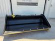 Raytree power rake bucket, front three-quarter view with quick-attach plate and empty interior