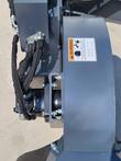 Raytree RMSG29 stump grinder drive housing and mounting bolts, rotating-parts warning label