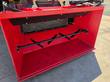RSDB72 bucket interior, black rubber liner and cross-shaft agitator, skid steer quick-attach frame visible