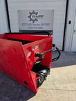 Red Raytree RSDB72 side discharge bucket outside Chupp Industrial Inc., black discharge chute visible