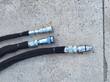 RTSG30 stump grinder's three braided hydraulic hoses with quick-connect couplers