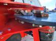 Underside of the RTSG30's skid-steer quick-attach plate and mount bolts