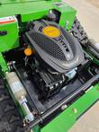 RATO 9.0 RV225-XPro engine in the green tracked mower's open engine bay, with a linear actuator beside it