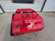 Red tracked mower at a front three-quarter angle, vented hood, two LED lights and rubber tracks
