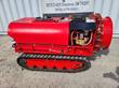 Red tracked orchard sprayer, side view: poly tank, brass nozzle ring, fan housing, pump and rubber track