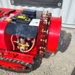 Orchard sprayer fan housing with brass nozzle ring, pump and hoses, remote control and charger on the deck