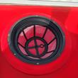 Inside the red sprayer tank fill opening, black mesh strainer basket with spoke frame