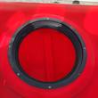 Open fill port on top of the red sprayer tank, black threaded collar ring with screws