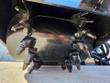 Milling drum underside with conical carbide teeth on a skid steer planer