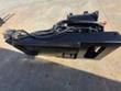 Skid steer planer quick-attach plate, hydraulic drum and coupler hoses viewed from above
