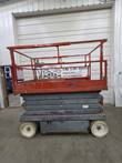 Skyjack SJIII 4632 electric scissor lift, stowed, full side view with red platform, gray scissor stack and non-marking tires
