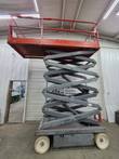 Skyjack SJIII 4632 with platform raised high, gray scissor arms fully extended, end view
