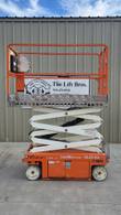 Snorkel S3215L scissor lift with platform partly raised, side view showing the scissor stack