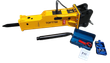 Yellow TOFT750 hydraulic breaker with black mount bracket, spare moil chisel, wrench box, nitrogen charge kit and manual